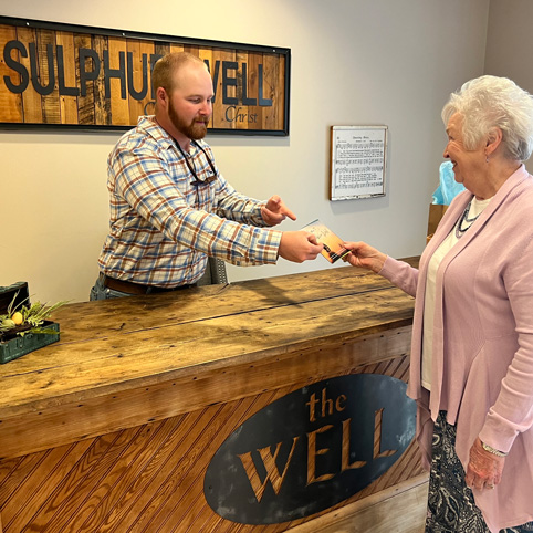 woman turning in a connect card